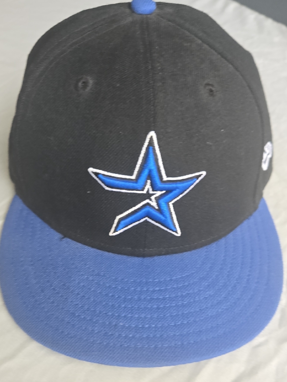 New Era Black and Blue Star Logo Snapback Hat